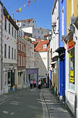 Guernsey, St Peter Port : Mill Street. Once trendy, today a shadow of its former self